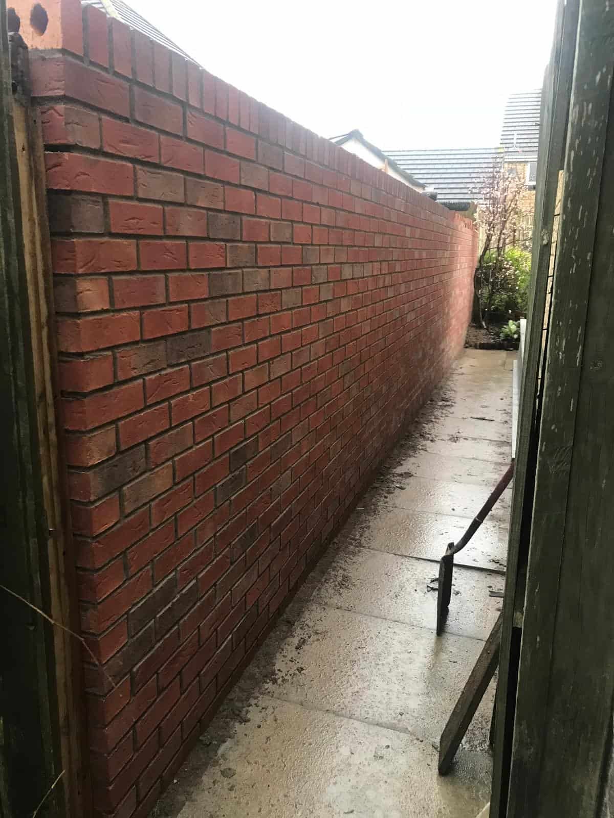 Brickwork & garden walls Gloucester Close-up of brick wall mortar joints and coping stone finish