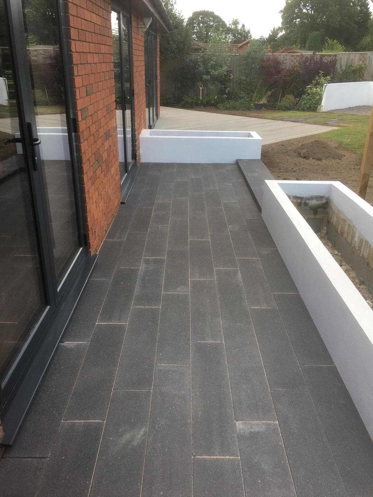 Landscaped garden with new patio and fencing in Gloucester by SJS Landscaping & Gardening