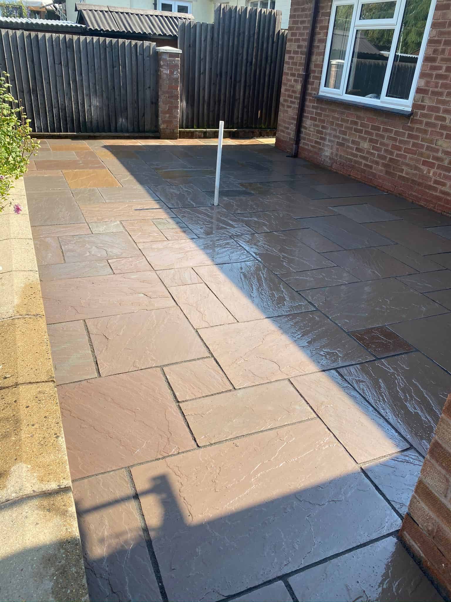 patios Gloucester New porcelain patio with clean edges installed in a Gloucestershire garden