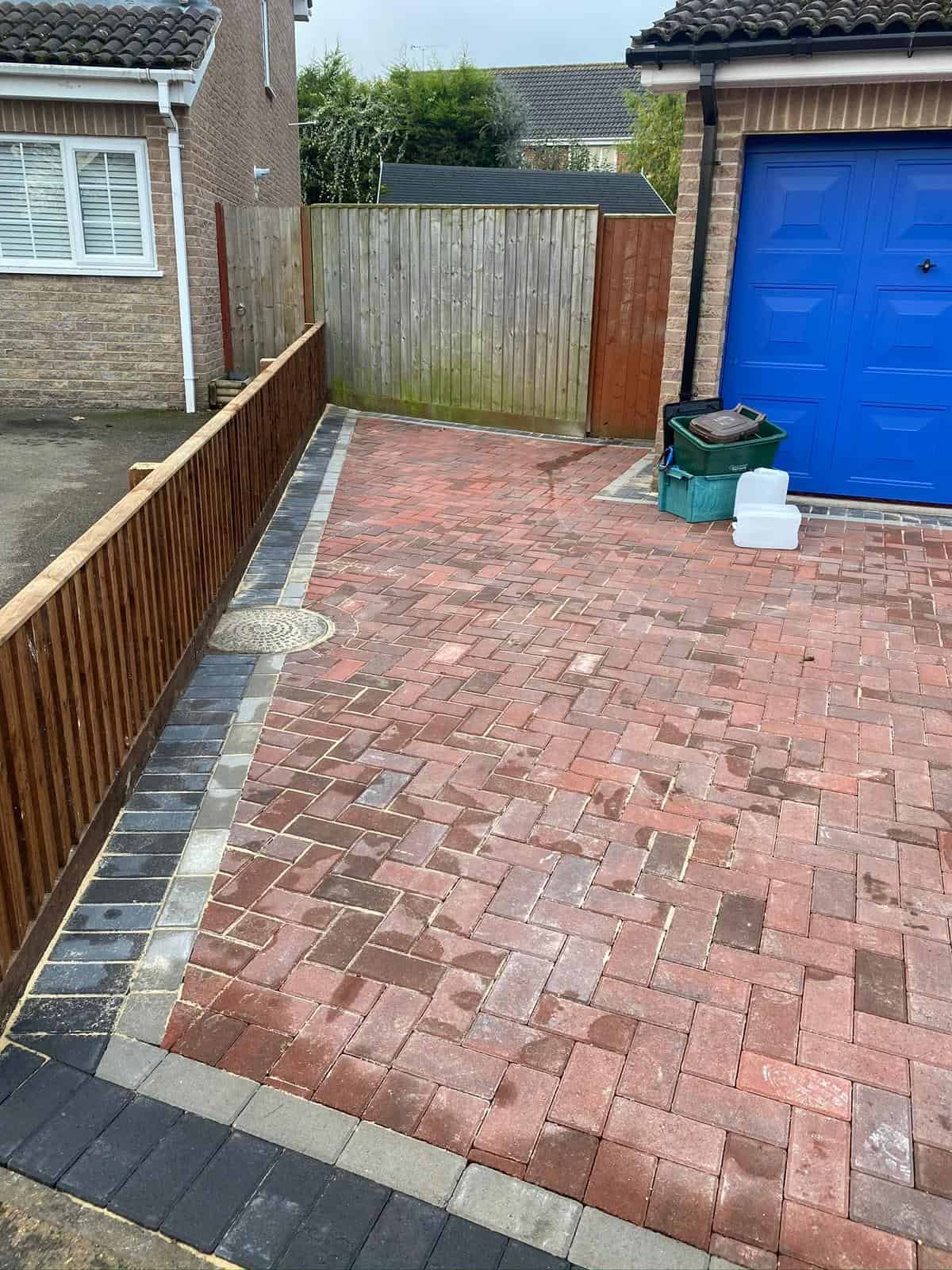 Close-up of block paving pattern and jointing sand on a completed driveway