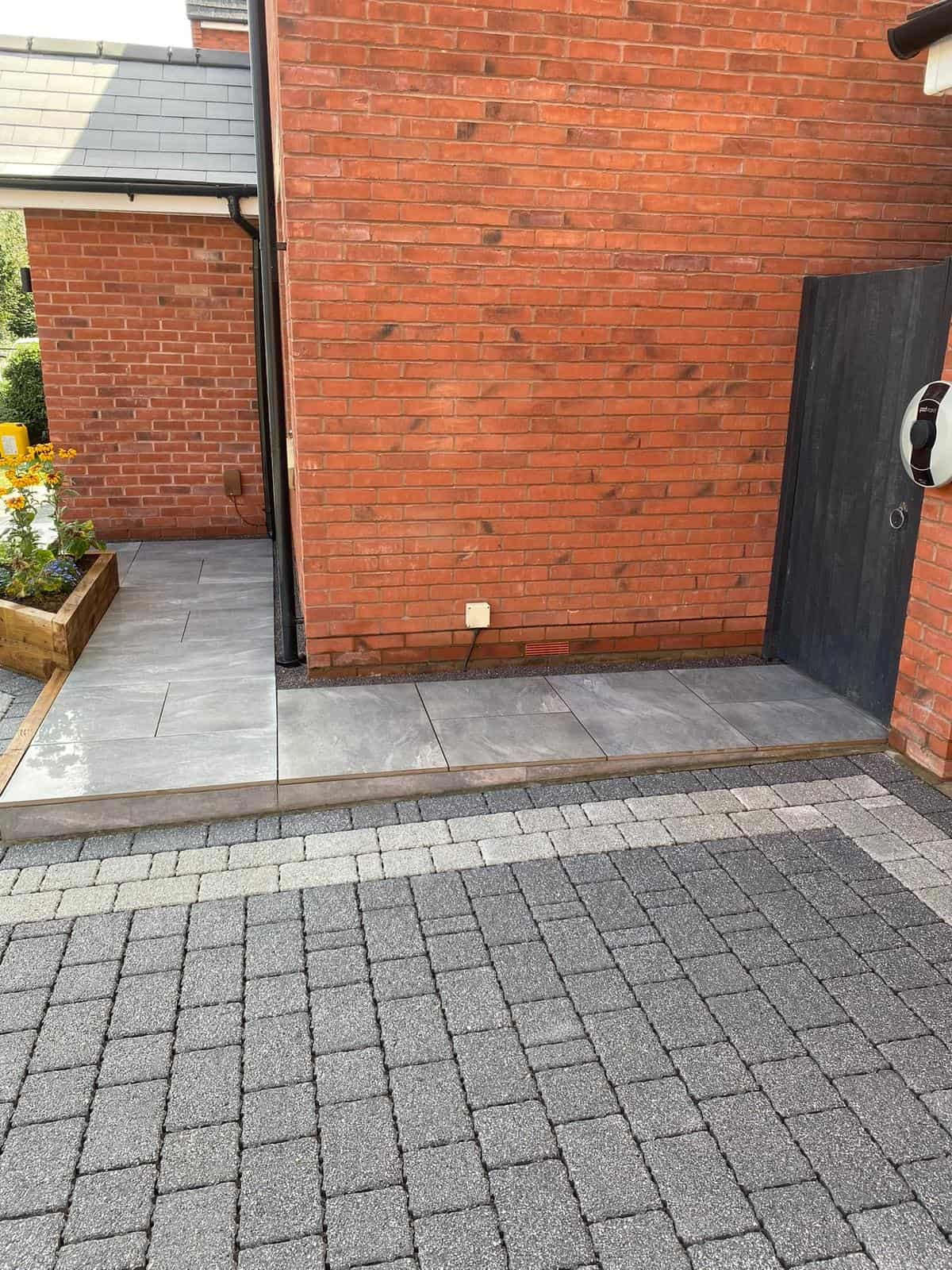 Block paving driveway with step edging and planting border in Gloucester