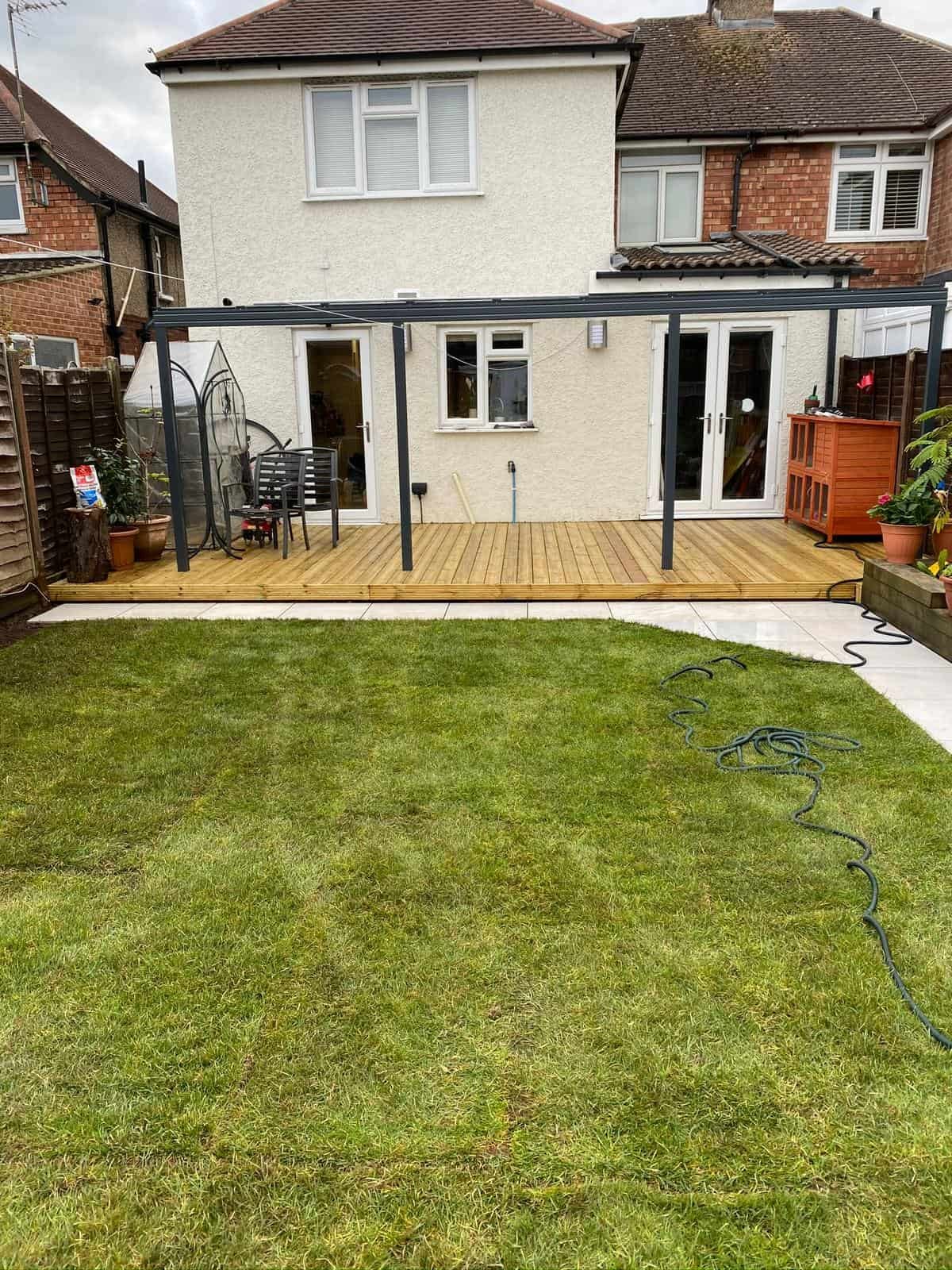 Timber decking with steps and railings in a Gloucestershire garden
