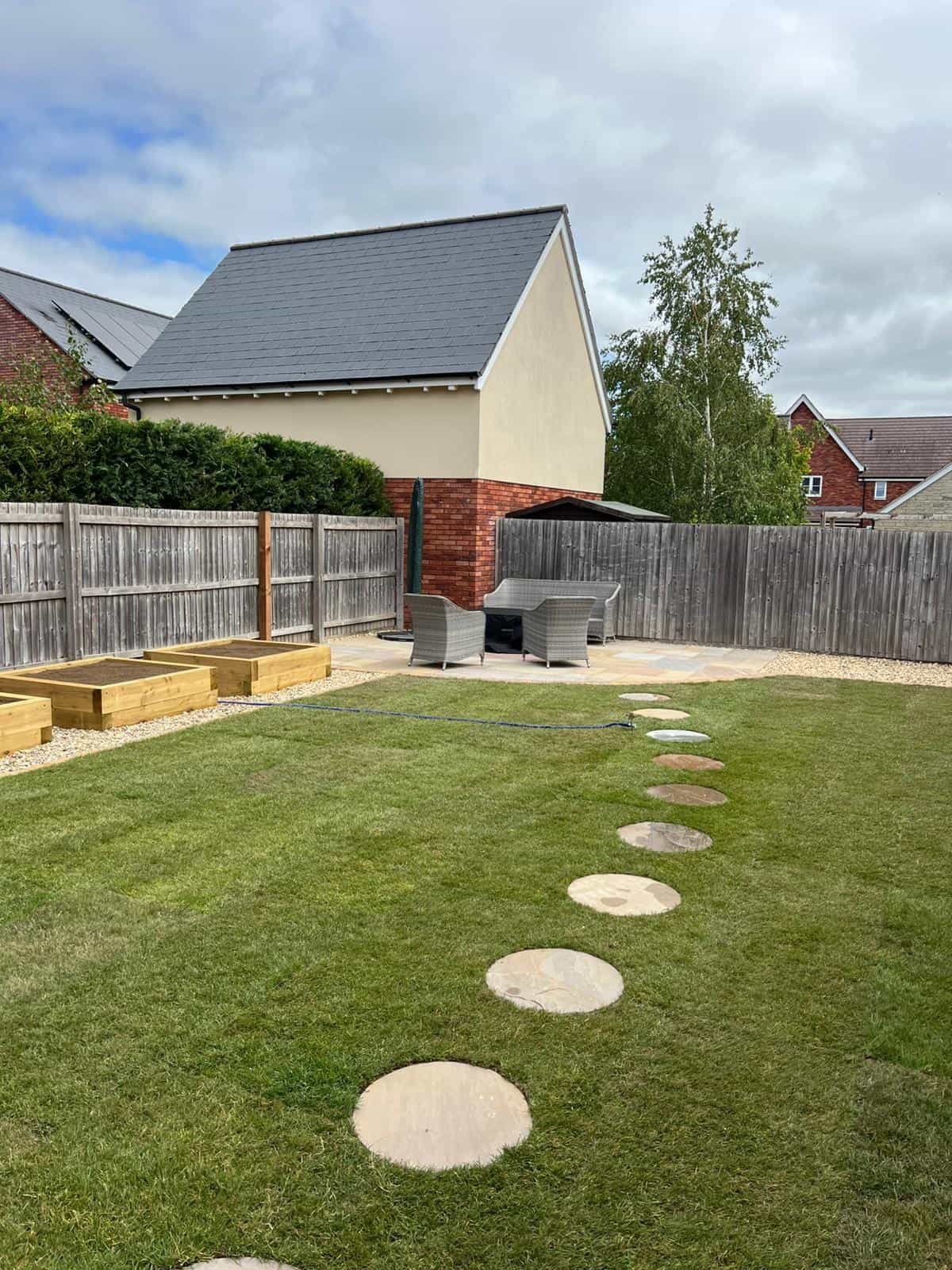 Fresh turf laid on prepared ground in a Gloucestershire garden