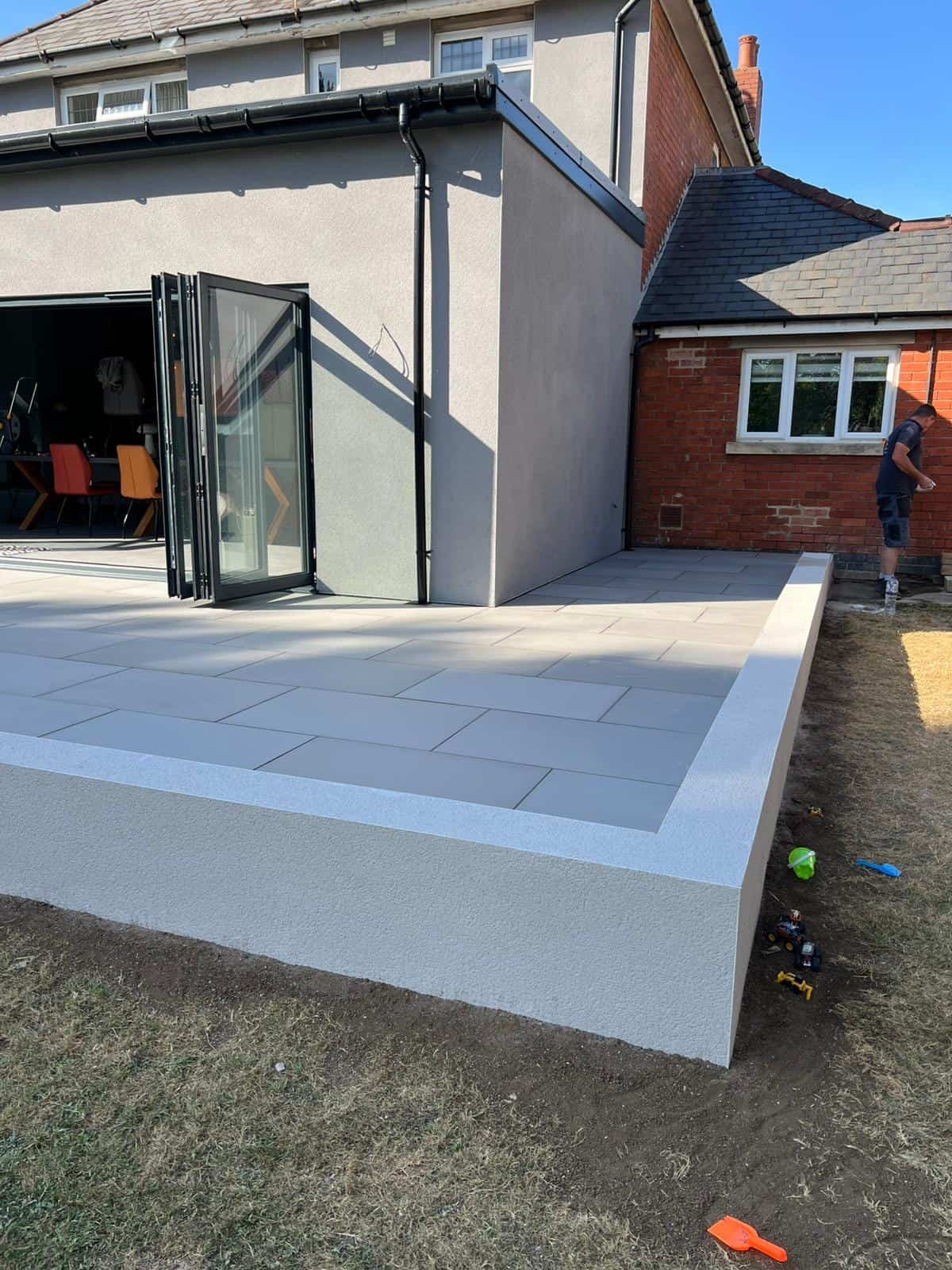 Brickwork & garden walls Gloucester Brick garden wall with coping stones built by SJS Landscaping in Gloucestershire
