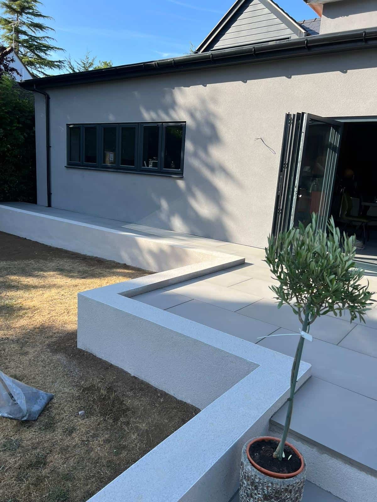 Brickwork & garden walls Gloucester Retaining wall with raised planting bed in a Gloucestershire garden